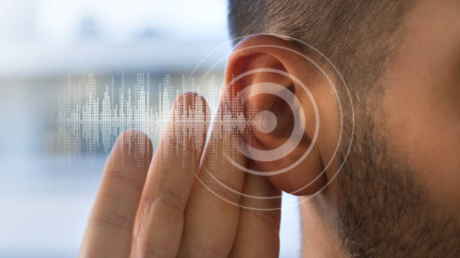 Young man with hearing problems or hearing loss. Hearing test concept. High quality photo